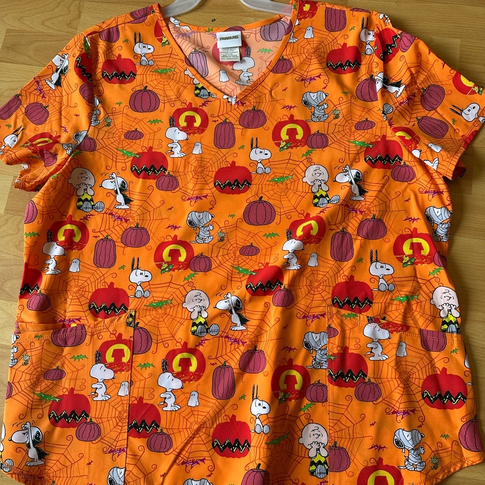 Peanuts orange scrub top